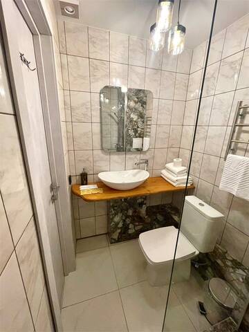 Фото номера Стандартный номер с двумя односпальными кроватями и дополнительным двуспальным диваном Гостевой дом Дарья г. Владимир 8